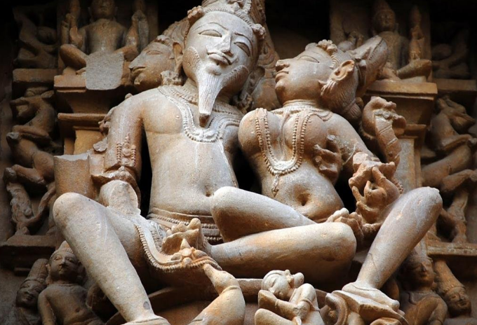 Depiction of Kamasutra carvings on the walls of the temples of India.
